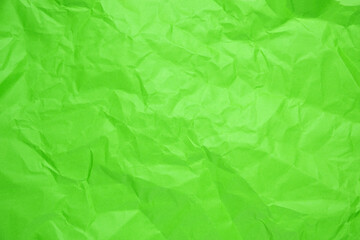 Close up of green crumpled empty sheet of paper.