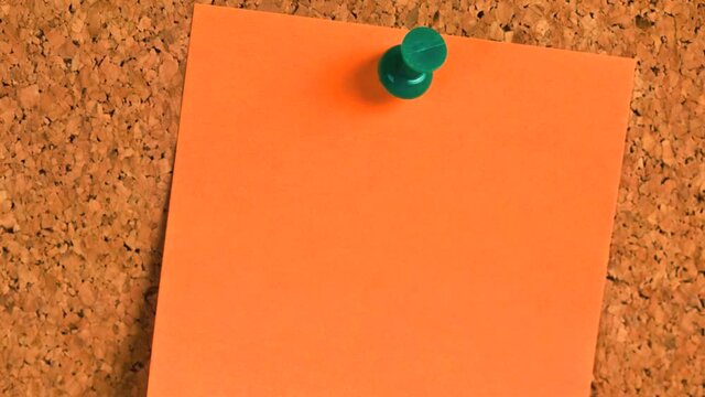 Postit note paper on a cork bulletin board