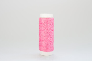 pink threads on a white background