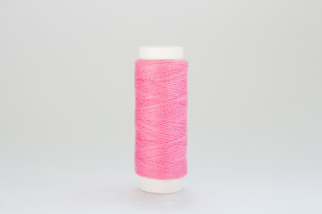 pink threads on a white background