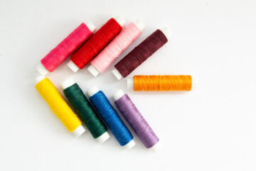 collage of threads for sewing different colors