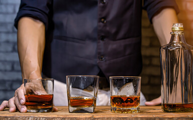Bartender Serve Whiskey, on wood bar, 
