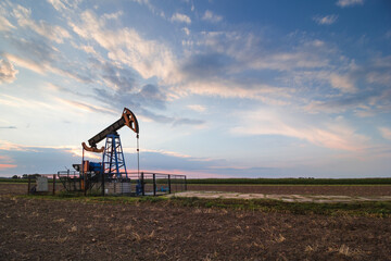 oil mine at sunrise.