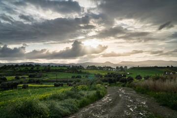 Beautiful idyllic, rural landscape of Cyprus in spring. Sunset after rainy day with vibrant colors
