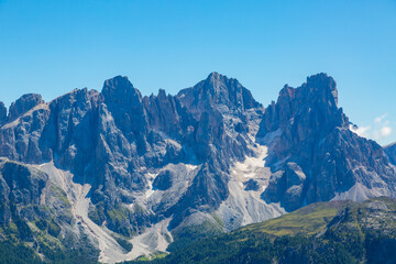 Fototapeta na wymiar peaks of pala group mountains pale di san Martino in blue sky
