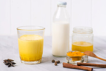 moon milk with turmeric honey and spices, top view