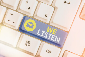 Text sign showing We Listen. Business photo text an organization willing to pay attention by...
