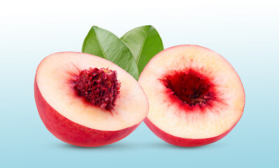 Nectarine fruit with leaf in blue background.