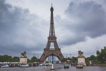 Fototapeta premium The eiffel tower on a cloudy day, in Paris, France.