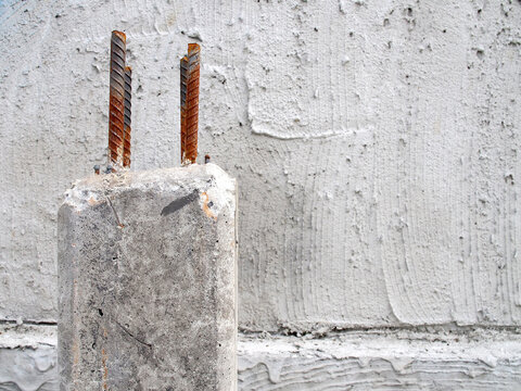 single concrete post with steel rebars structure with copy space, construction site
