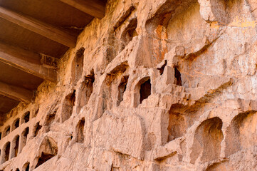 It's Longmen Grottoes ( Dragon's Gate Grottoes) or Longmen Caves.UNESCO World Heritage of tens of thousands of statues of Buddha and his disciples