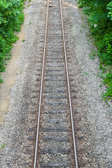 Railway, train tracks close up. Beautiful details of the iron and gravel