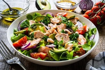 Foto op Plexiglas Salmon salad - roasted salmon and vegetables on wooden background  © Jacek Chabraszewski
