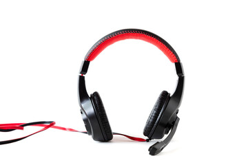 Fototapeta na wymiar Wired, soft headphones with a microphone in black and red on an isolated white background.