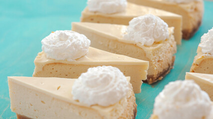 cheesecake pattern, servings of cheesecake on a blue background top view