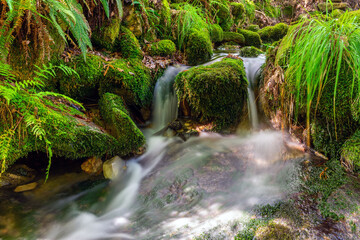 blurred image of a small river waterfall close-up, long exposure, beautiful natural landscape,  background