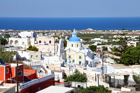 A blue domed church in the traditional village of Vothonas in Santorini, Greece.