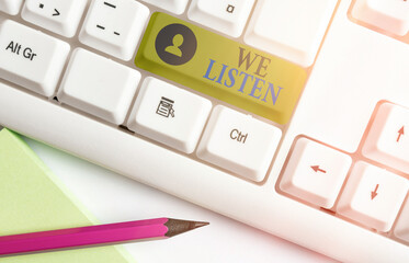Word writing text We Listen. Business photo showcasing an organization willing to pay attention by...