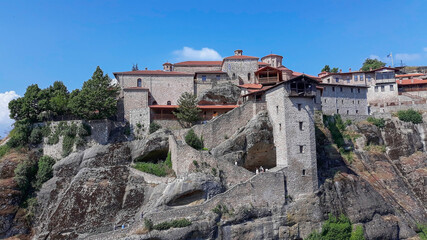 Fototapeta na wymiar Holy Monastery of Great Meteoron, Greece, summer 2019. It is located in Meteora where the monasteries are on top of gigantic rocks. Greece's famous tourist destination with picturesque landscapes.