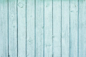 Wooden background covered with shabby old blue paint.