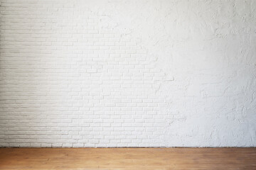 Empty room without furniture with a white brick wall and wooden floor. Realistic blank for interior design.