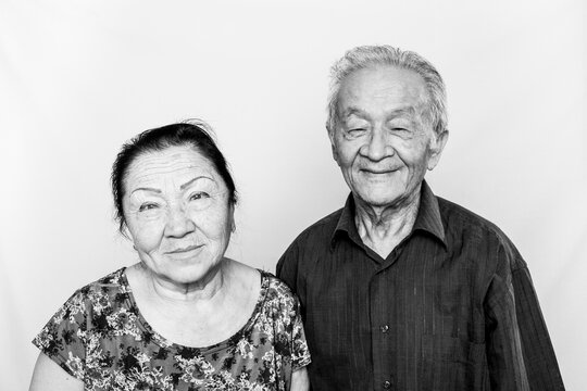 Asian senior elderly couple, happy old age, pensioners, forever together. Black and white photo.