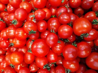 a lot of grape tomatoes for sale at farmer market