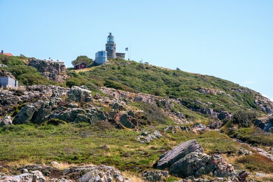 The Kullen lighthouse from below in sunny summer day at Kullaberg nature reserve in south Sweden, Skane. Sweden tourism