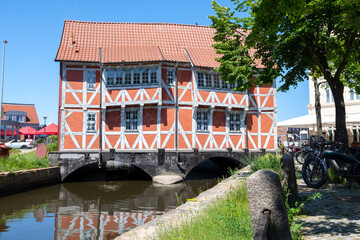 Red half-timbered house from the 17th century called Gewoelbe (vault), protected as a historic...