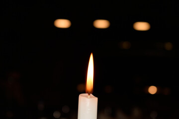 The flame of a candle with black background