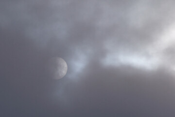 Naklejka na ściany i meble The moon among the clouds black and white