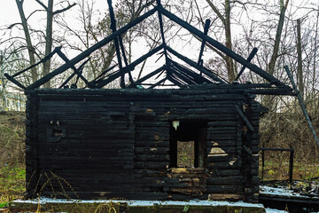 ruins of a burnt wooden house after a fire