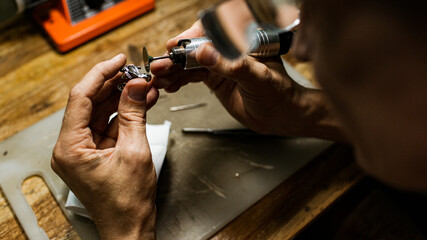 close-up. The jeweler makes a silver ring. On the island of Bali. Indonesia - obrazy, fototapety, plakaty
