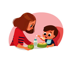 Mom feeding baby boy. Healthy food. Mother and little son. Raising of child.