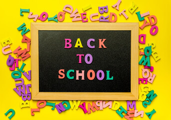 Back to school text colorful letters on blackboard