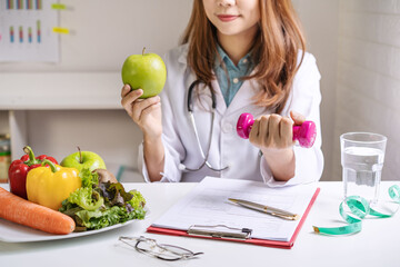 Nutritionist giving consultation to patient with healthy fruit and vegetable, Right nutrition and...