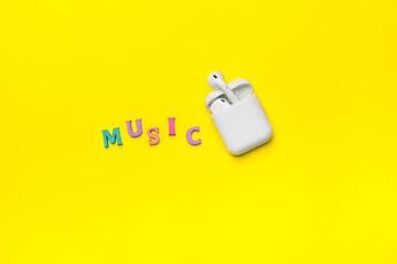 Air Pods Pro with Charging Case on Yellow Background.
