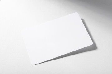 Photo of mockup business card on white background. Template for branding identity and company name.