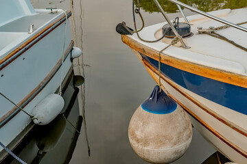 The front end of two pleasure boats moored in Thurne Dyke in the Norfolk Broads National Park
