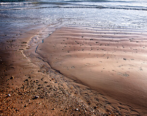 Ripples in sand making pattern at low tide  in Southsea, Hampshire, UK.