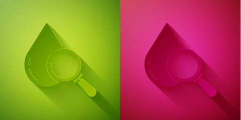 Paper cut Drop and magnifying glass icon isolated on green and pink background. Paper art style. Vector Illustration.