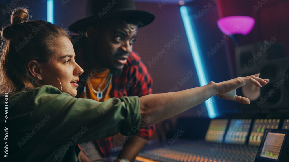 Aufkleber stylish producer and audio engineer working together in music recording studio on new album, talk, u