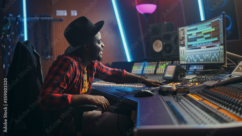 Poster portrait of audio engineer working in music recording studio, uses mixing board create modern sound.