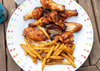Spicy chicken wings and seasoned fries