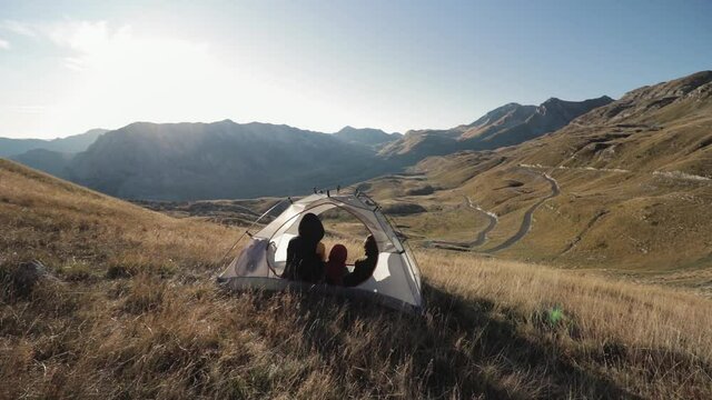 People inside the tent. on a mountainside in Montenegro mooving camera