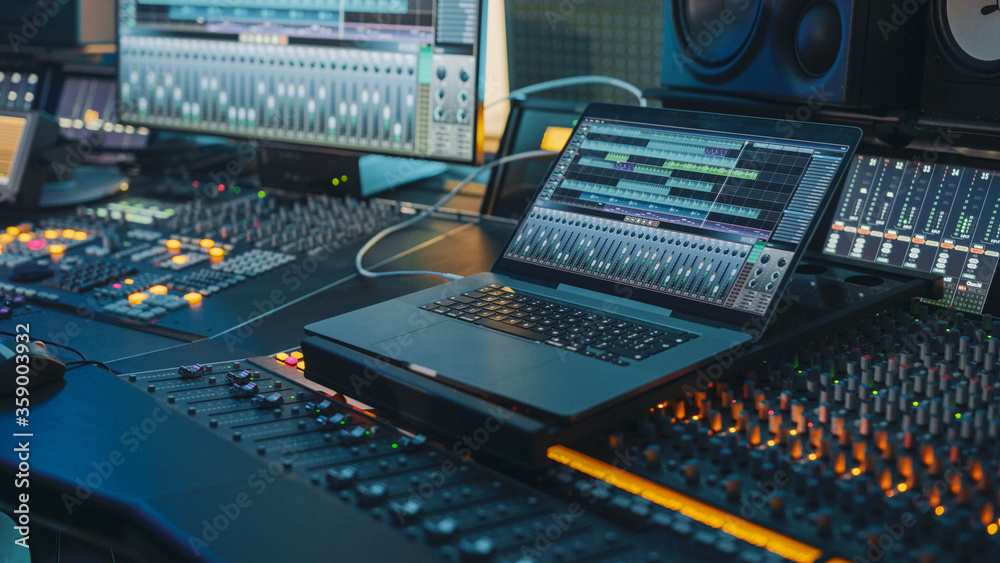 Fototapete modern music record studio control desk with laptop screen showing user interface of digital audio w