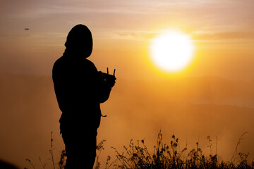 close-up. drone pilot at dawn on the volcano Batur. Bali Indonesia © alexzhilkin