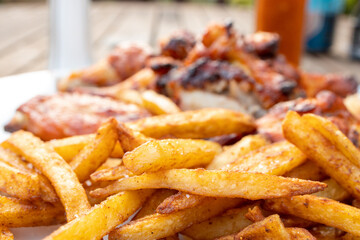 Spicy chicken wings and seasoned fries