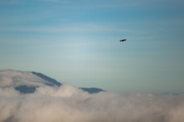 close-up. A man controls a drone in the dawn sun on the volcano BATUR. Bali Indonesia