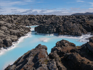 Blue lagoon water in lava field landscape, natural geothermal spa area near Reykjavik, Iceland